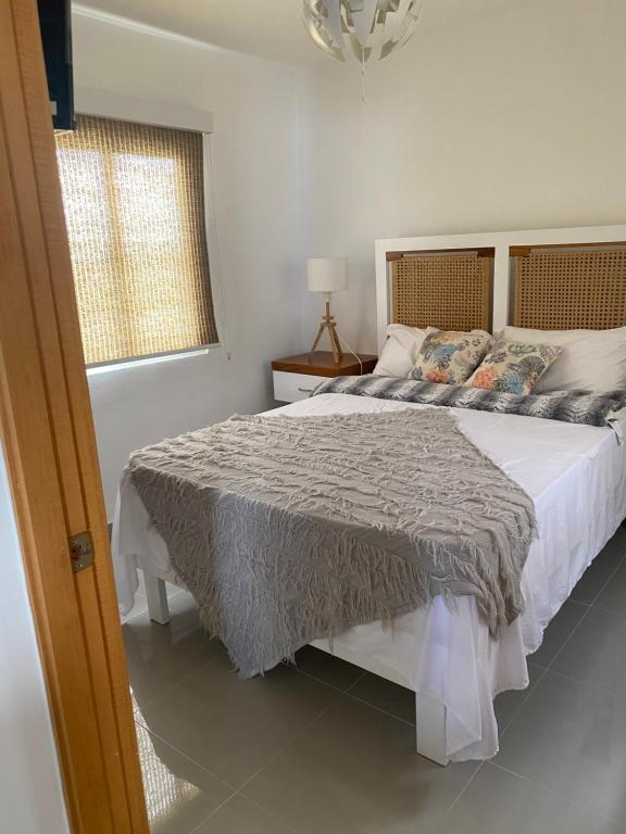 Postel nebo postele na pokoji v ubytování Apartment Serena Village Punta Cana