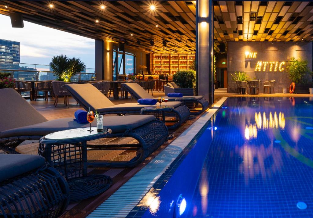 a swimming pool on the roof of a building at Northern Charm Hotel in Ho Chi Minh City