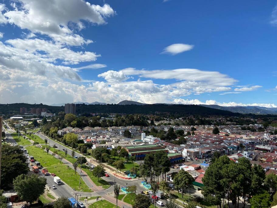 an aerial view of a city with buildings and trees at Apartamento Entero Hermosa Vista in Bogotá