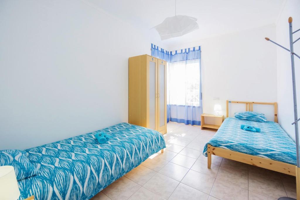 Postel nebo postele na pokoji v ubytování H2O GuestHouse