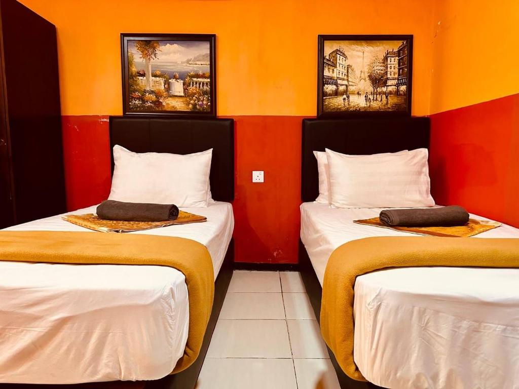 Postel nebo postele na pokoji v ubytování Smart Budget Hotel - Klang