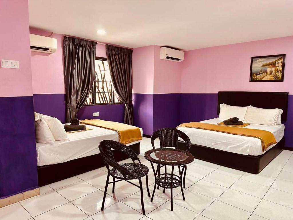 Postel nebo postele na pokoji v ubytování Smart Budget Hotel - Klang