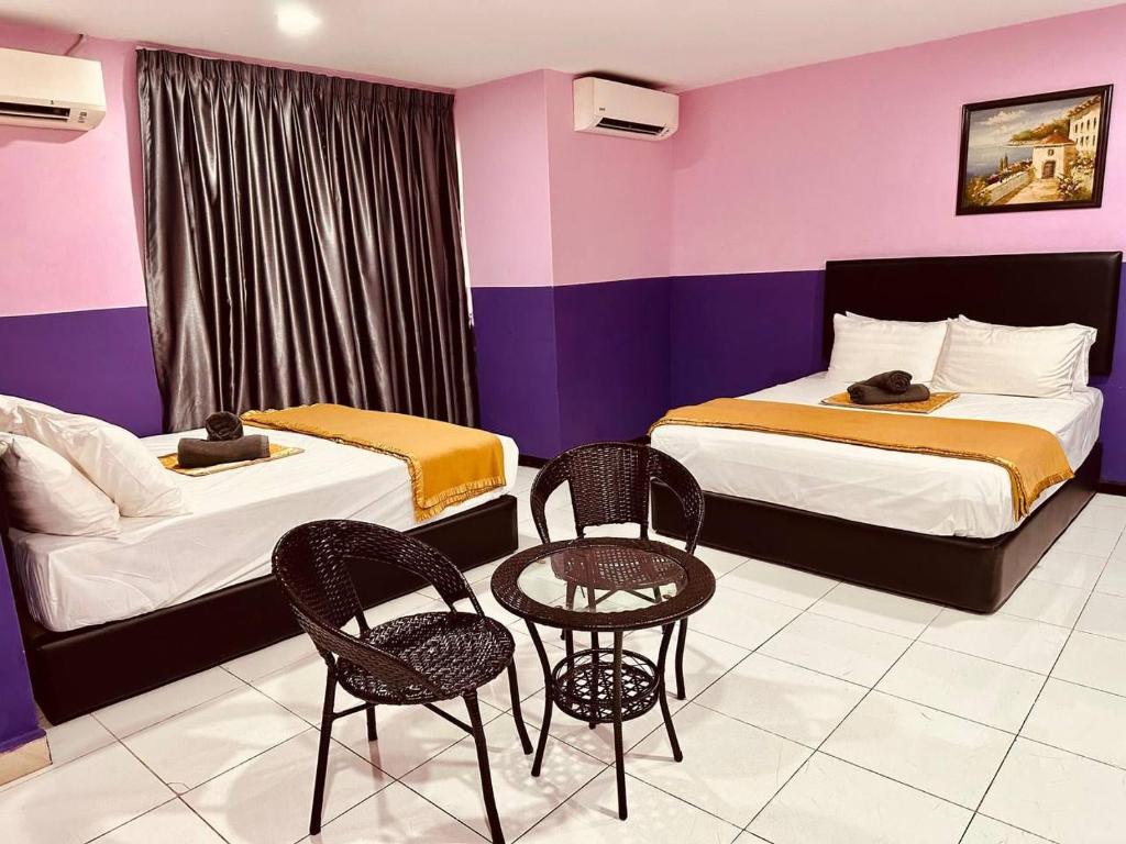 Postel nebo postele na pokoji v ubytování Smart Budget Hotel - Klang