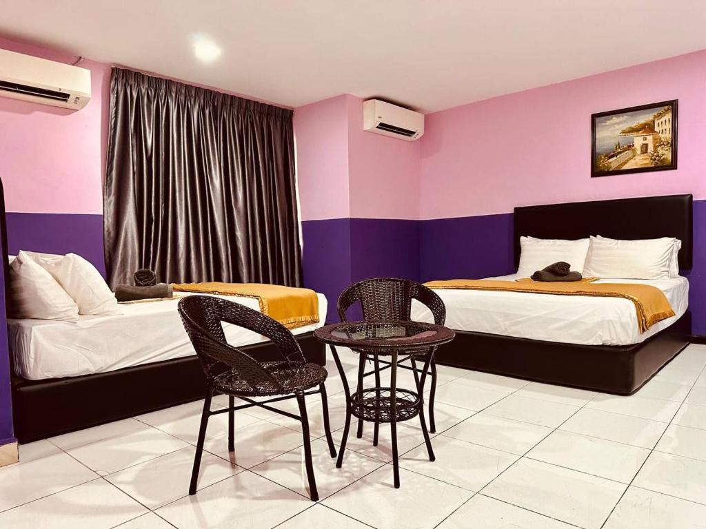 Postel nebo postele na pokoji v ubytování Smart Budget Hotel - Klang