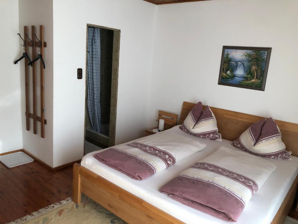 Postel nebo postele na pokoji v ubytování Gästehaus Wasserburger