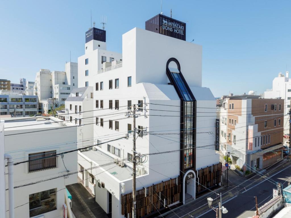 a rendering of a white building in a city at Miyazaki Lions Hotel in Miyazaki