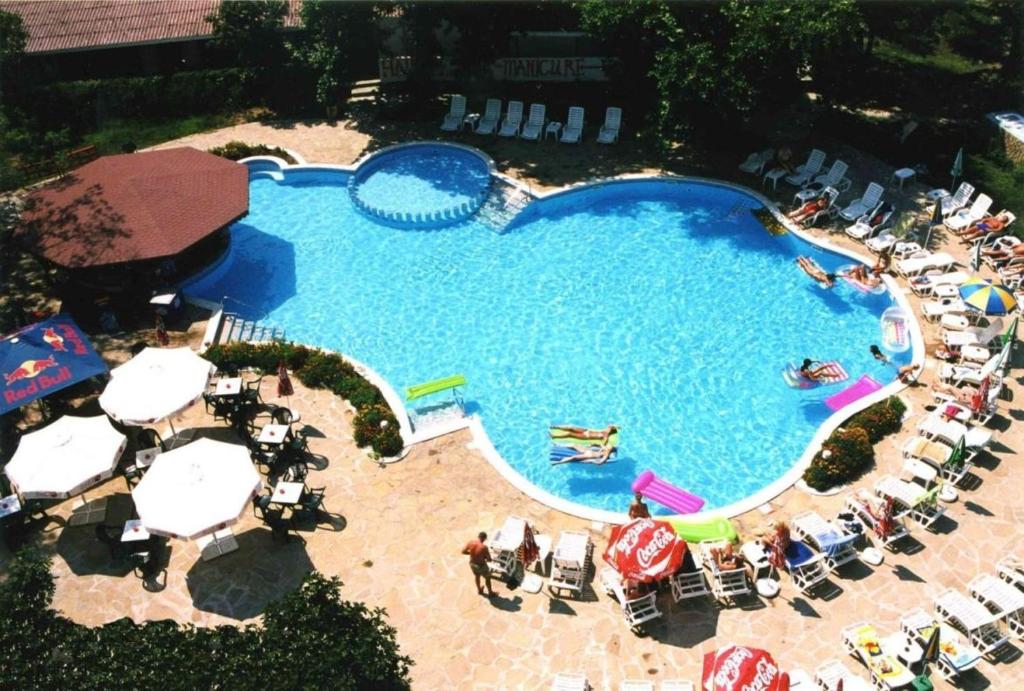 an overhead view of a swimming pool with chairs and umbrellas at Hotel Olymp in Sunny Beach