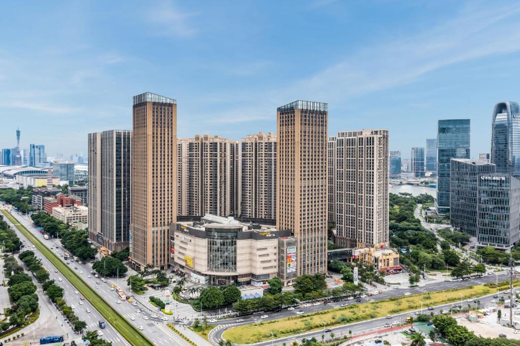 an aerial view of a city with tall buildings at Pazhou Angda International Aparthotel Canton Fair Branch in Guangzhou