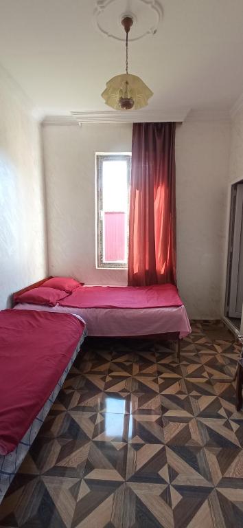 Postel nebo postele na pokoji v ubytování Likas haus