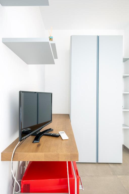 TV a/nebo společenská místnost v ubytování Serafini Rooms