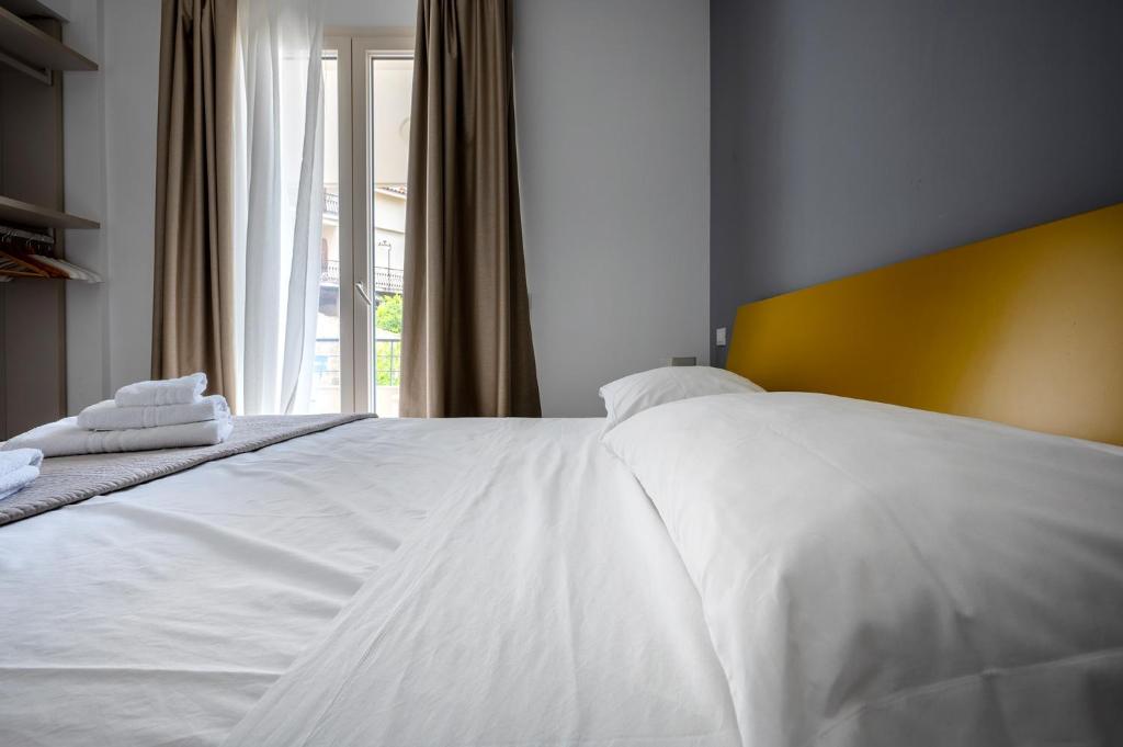 Postel nebo postele na pokoji v ubytování Serafini Rooms