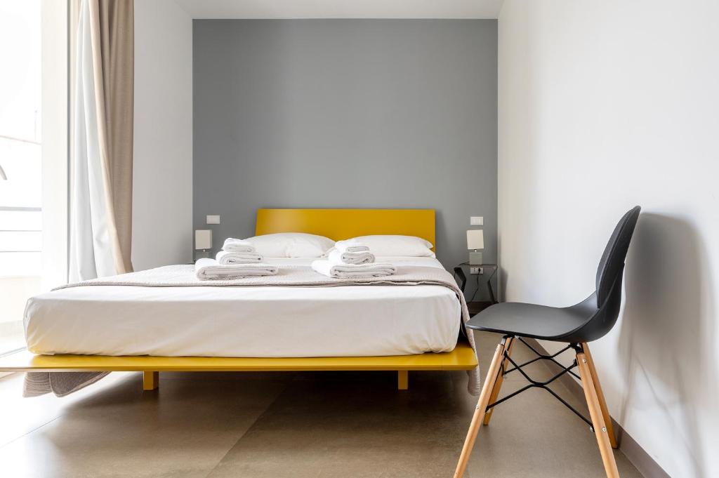 Postel nebo postele na pokoji v ubytování Serafini Rooms