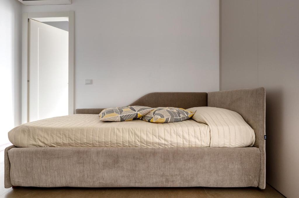 Postel nebo postele na pokoji v ubytování Serafini Rooms