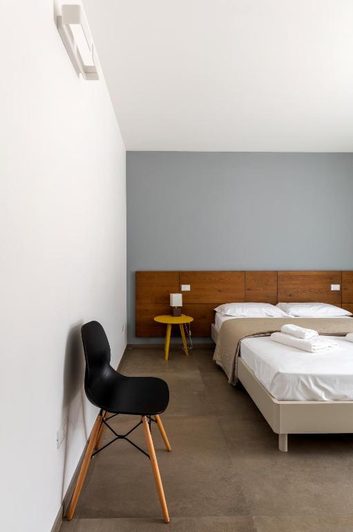 Postel nebo postele na pokoji v ubytování Serafini Rooms
