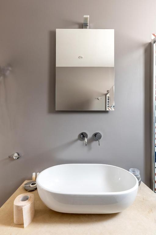 Koupelna v ubytování Serafini Rooms
