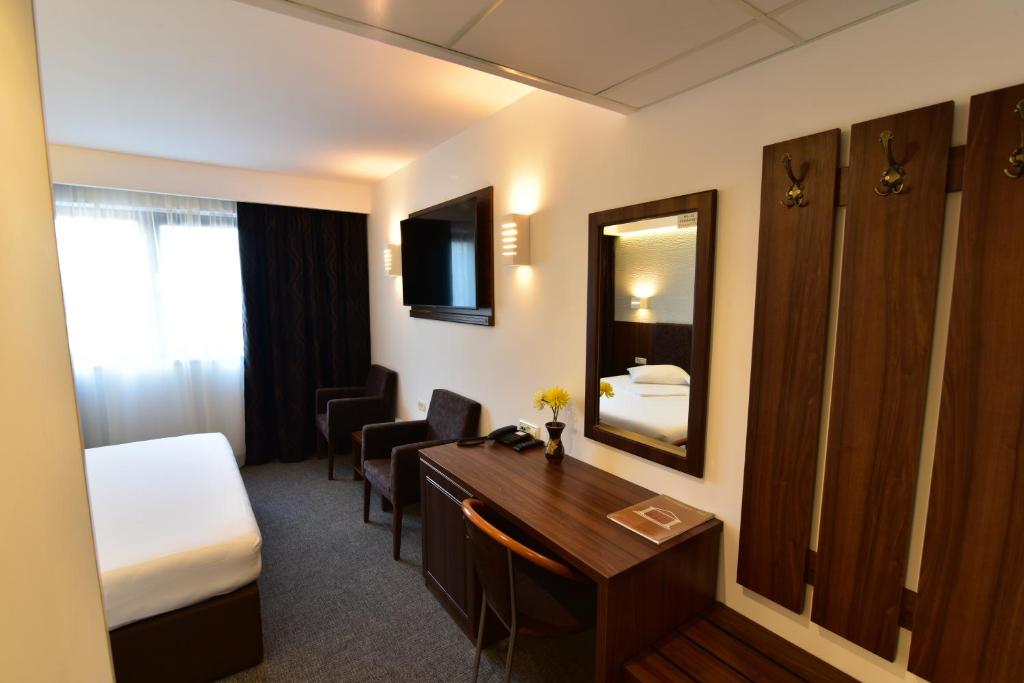 Postel nebo postele na pokoji v ubytování Hotel Forum