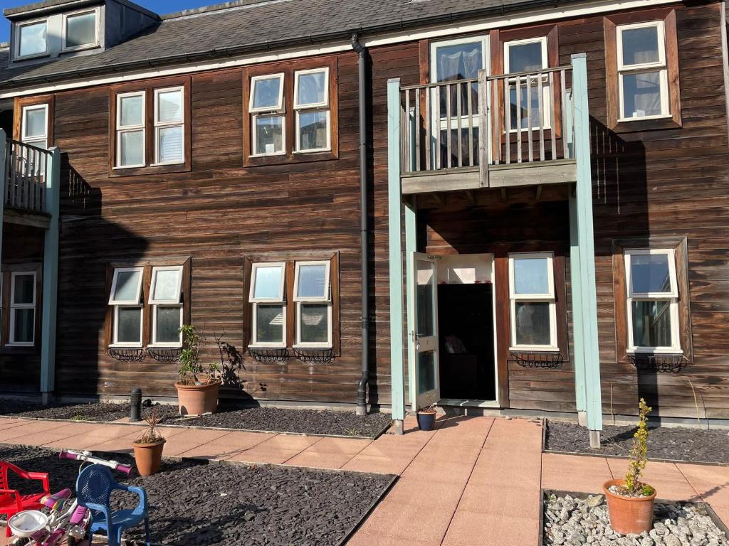 a large wooden building with a staircase on it at 69D Victoria Street in Sheffield