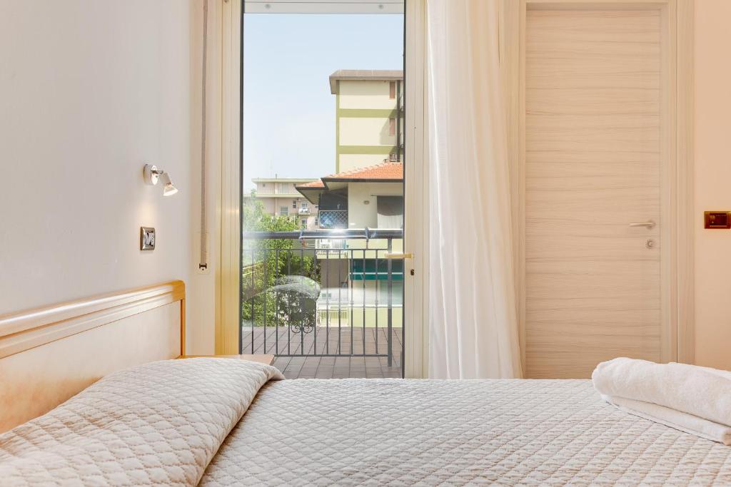 Postel nebo postele na pokoji v ubytování Hotel Costaverde