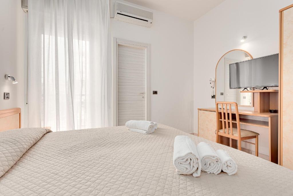 Postel nebo postele na pokoji v ubytování Hotel Costaverde