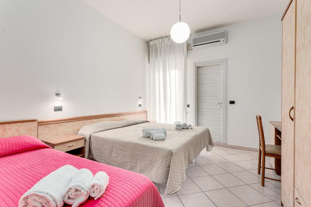 Postel nebo postele na pokoji v ubytování Hotel Costaverde