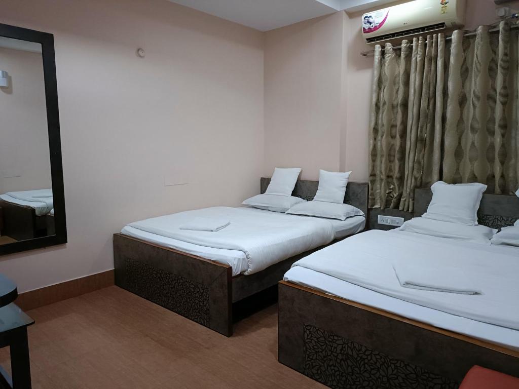 Letto o letti in una camera di Hotel Satyam