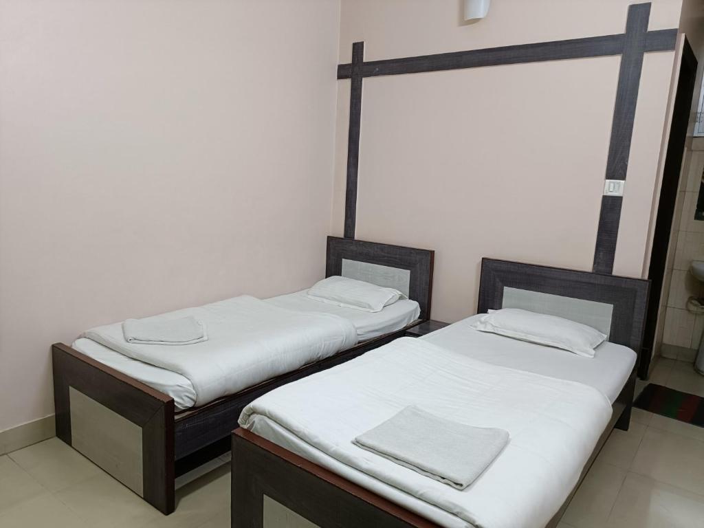 Letto o letti in una camera di Hotel Satyam