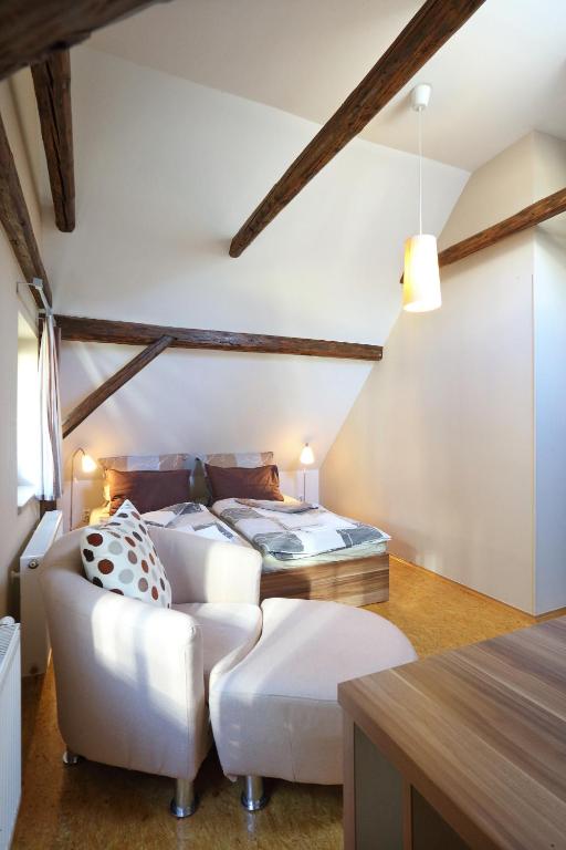 Postel nebo postele na pokoji v ubytování Apartmány Milenium