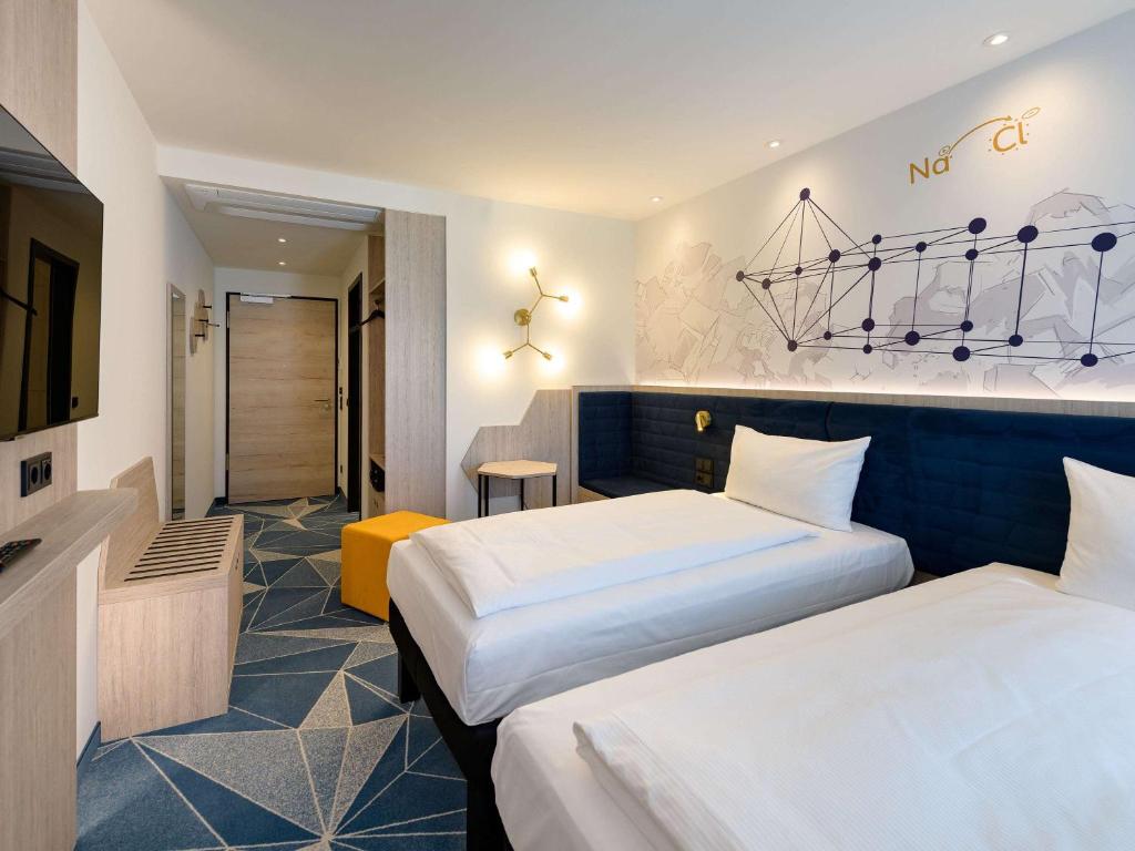 Postel nebo postele na pokoji v ubytování ibis Styles Bad Reichenhall