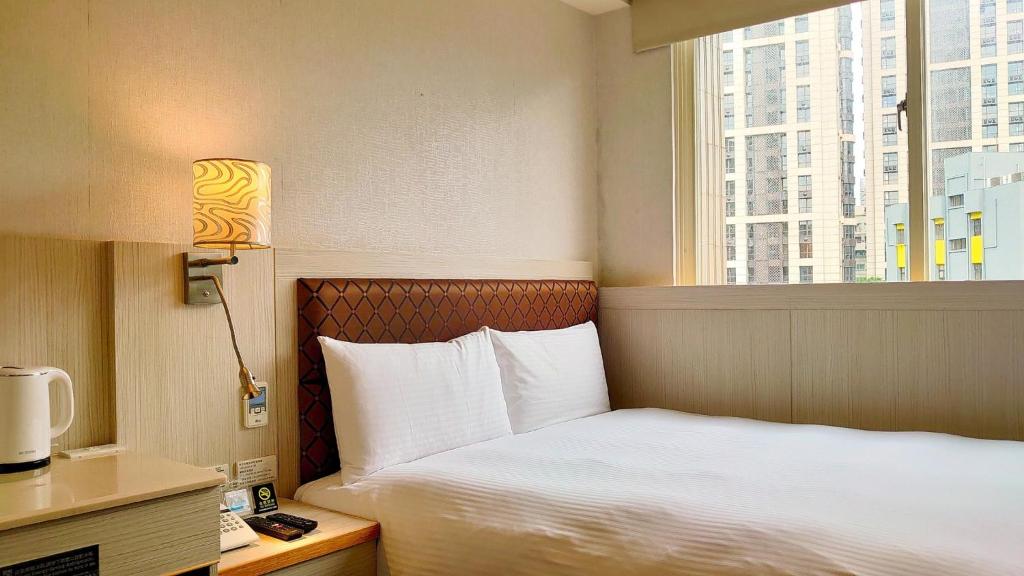 Postel nebo postele na pokoji v ubytování Hub Hotel Banqiao Branch