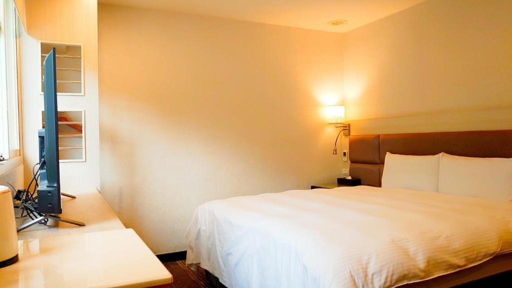 Postel nebo postele na pokoji v ubytování Hub Hotel Banqiao Branch