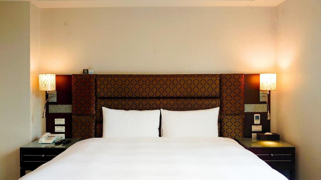 Postel nebo postele na pokoji v ubytování Hub Hotel Banqiao Branch
