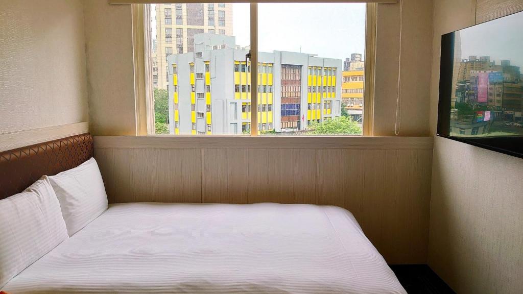 Postel nebo postele na pokoji v ubytování Hub Hotel Banqiao Branch