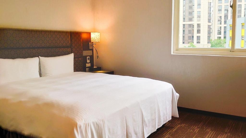 Postel nebo postele na pokoji v ubytování Hub Hotel Banqiao Branch