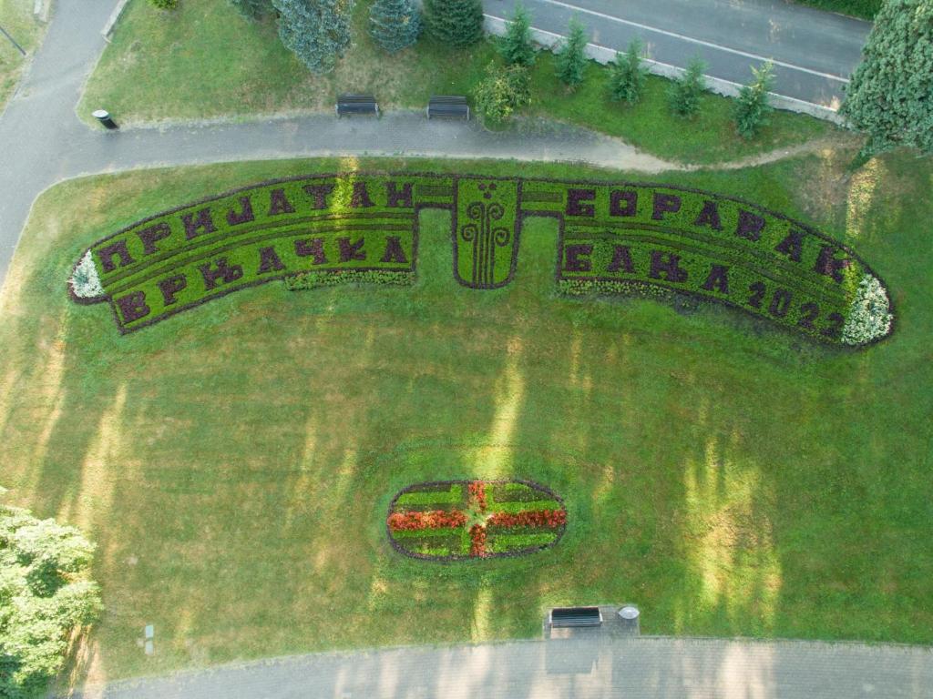 an aerial view of a park with a sign in the grass at Gray apartman in Vrnjačka Banja
