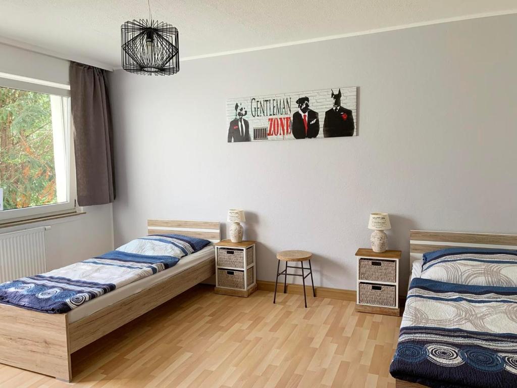 Postel nebo postele na pokoji v ubytování Apartments Hemer