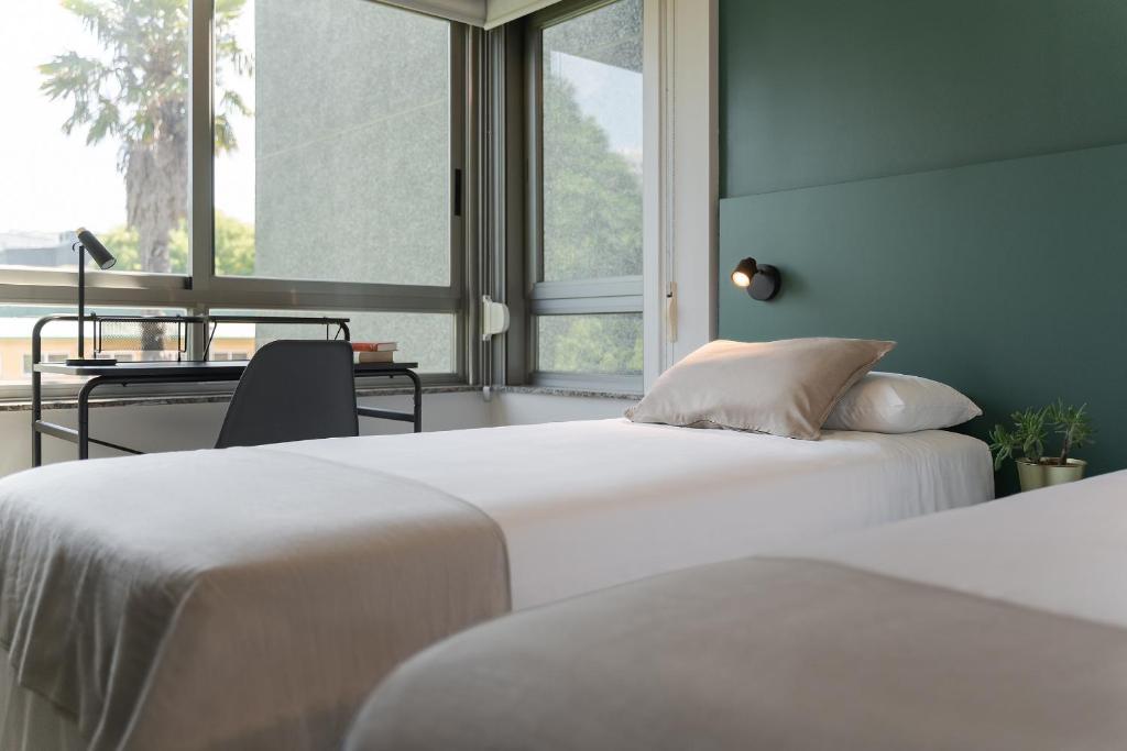 Posteľ alebo postele v izbe v ubytovaní Someso Apartamentos Turisticos