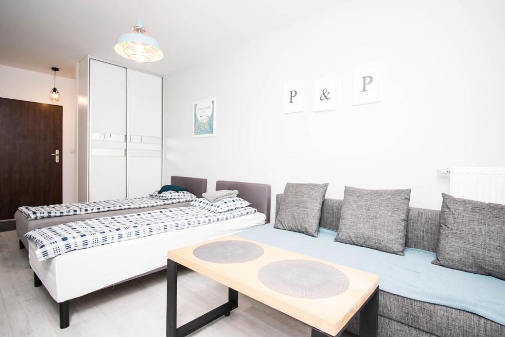 Posteľ alebo postele v izbe v ubytovaní WAW Apartamenty Cybernetyki