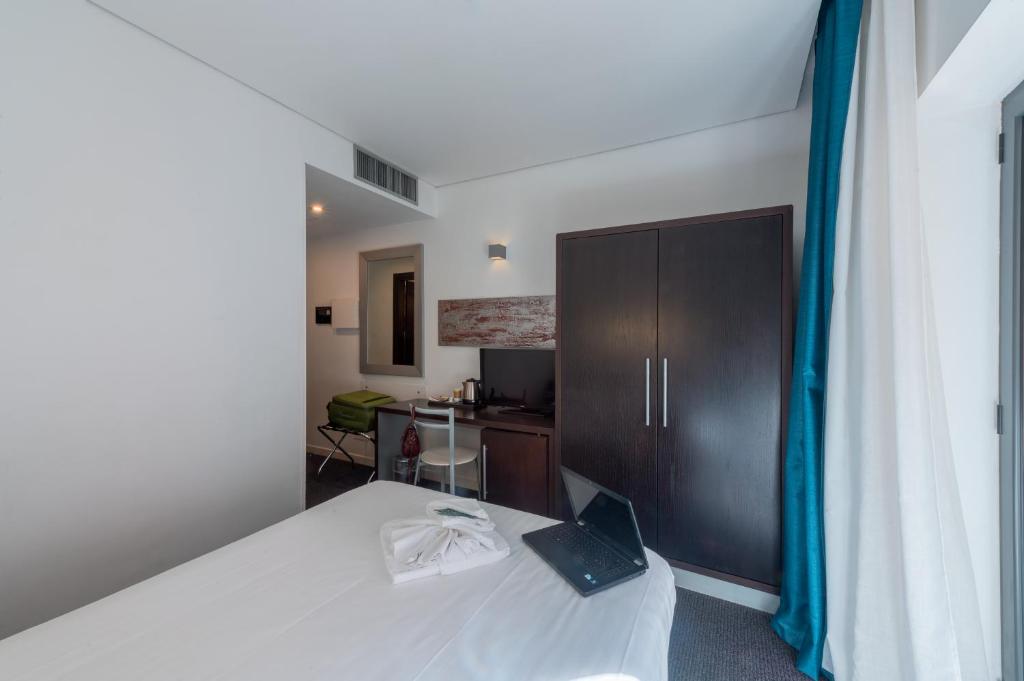 Postel nebo postele na pokoji v ubytování Mercure Palermo Centro