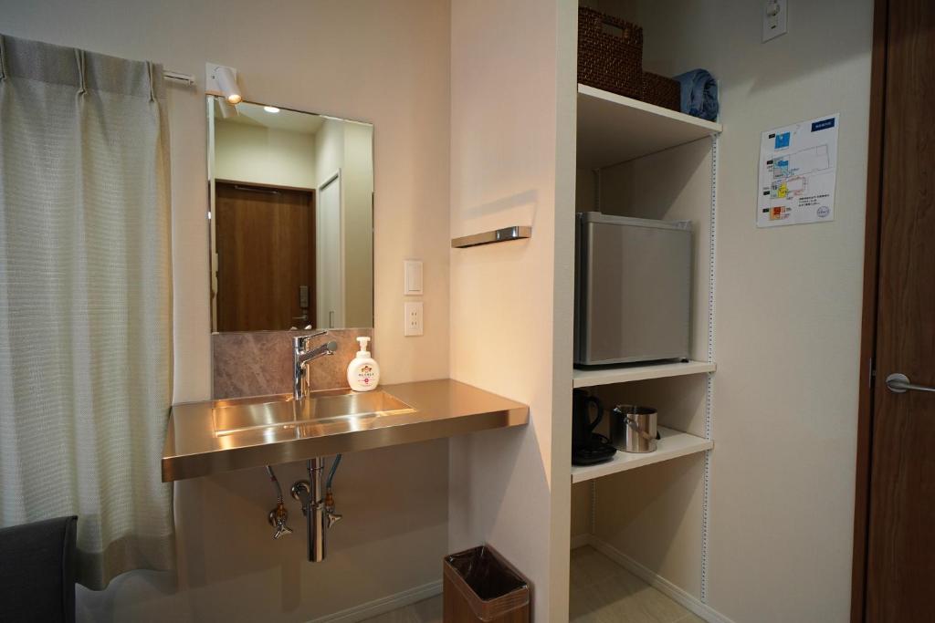 Kuchyň nebo kuchyňský kout v ubytování Etcetera Guest House