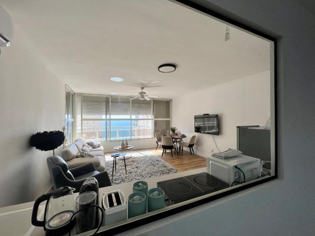 a living room with a view of a living room at The Symphony of the Breeze in Netanya