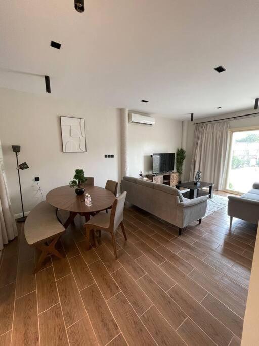 a living room with a table and a couch at Al Hada Hills Residential Unit in Al Hada