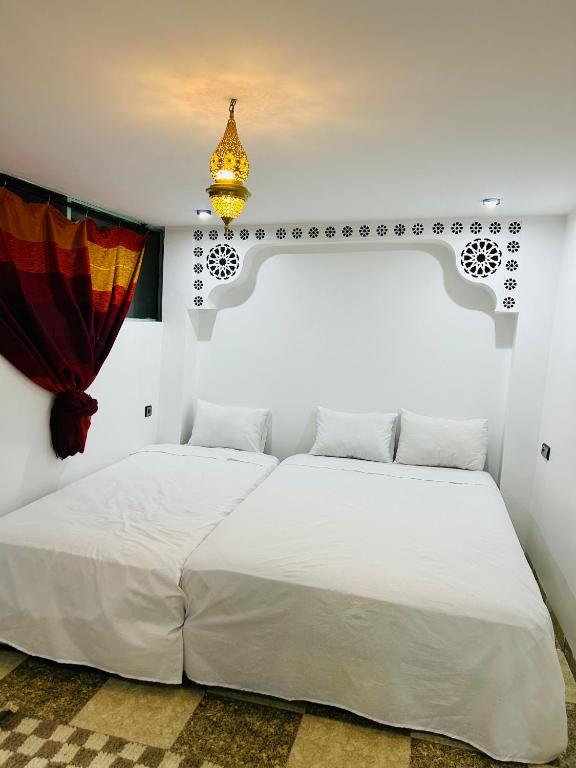 Postel nebo postele na pokoji v ubytování Riad Cascada