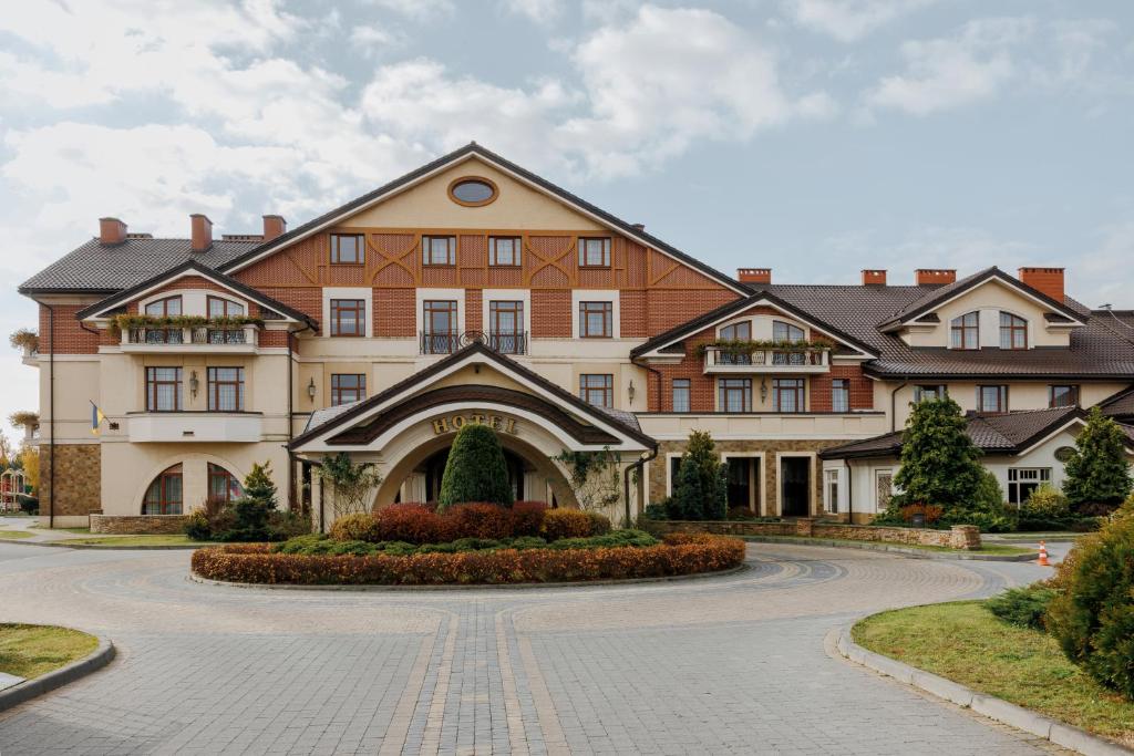a large building with a driveway in front of it at Panska Gora in Lviv