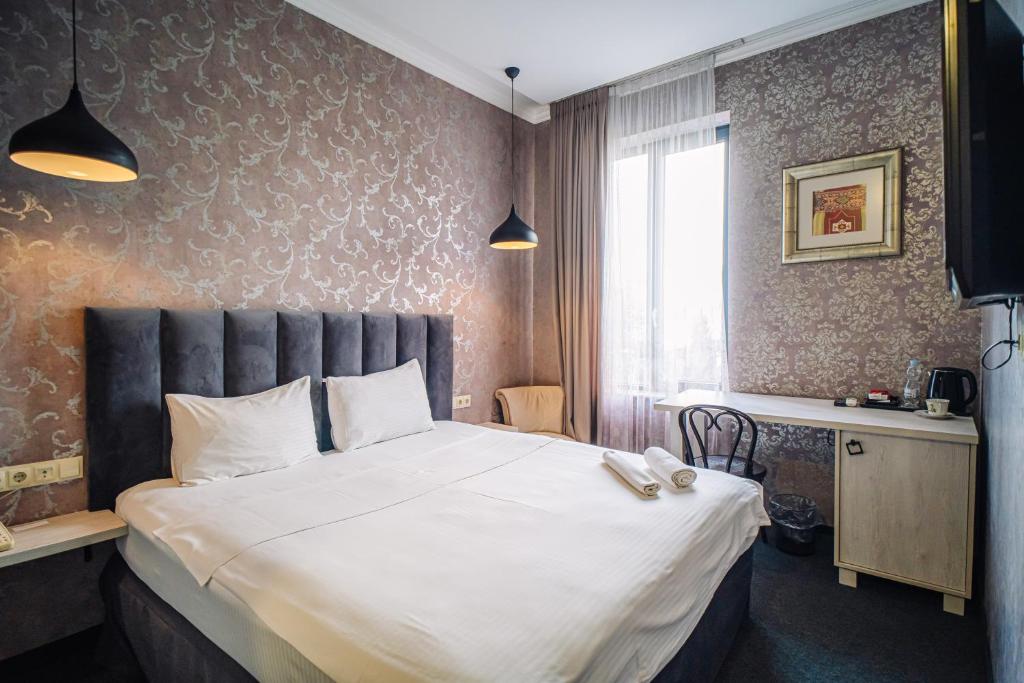 Postel nebo postele na pokoji v ubytování Hotel Day Inn