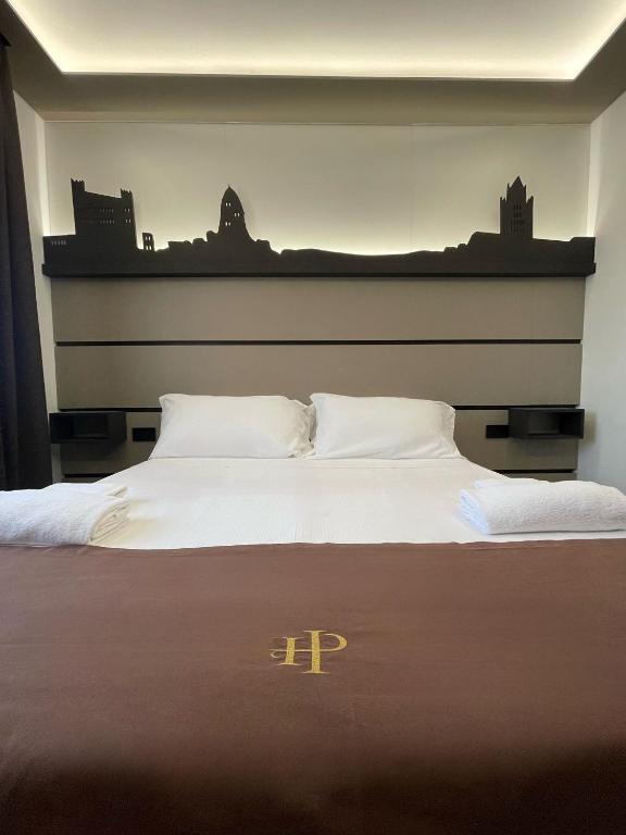 Łóżko lub łóżka w pokoju w obiekcie Palace Hotel Due Ponti