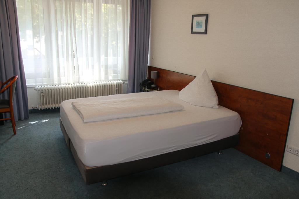 Postel nebo postele na pokoji v ubytování Hotel Alpha