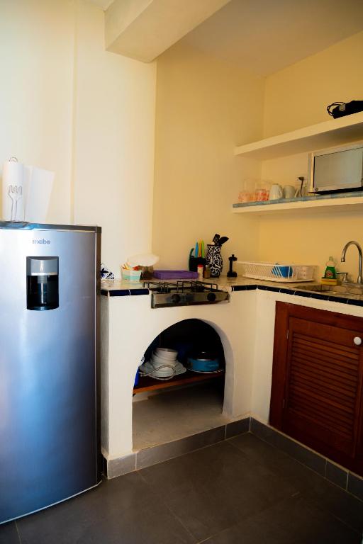 Kuchyň nebo kuchyňský kout v ubytování Hotel Flamingos Inn