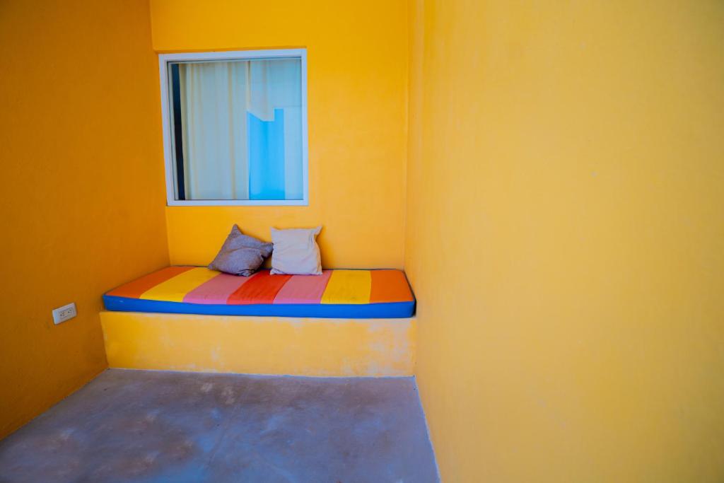 Postel nebo postele na pokoji v ubytování Hotel Flamingos Inn