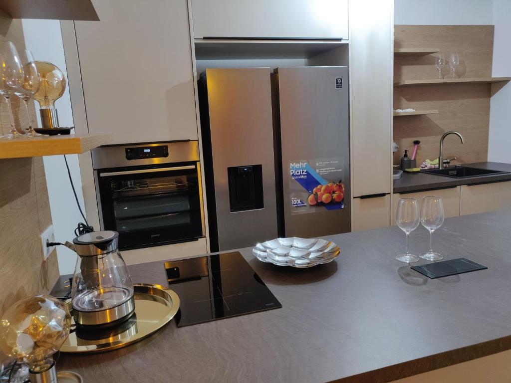 a kitchen with a counter with wine glasses on it at Private Parking-Top Retreat Residence in Vienna - Long Stays available in Vienna
