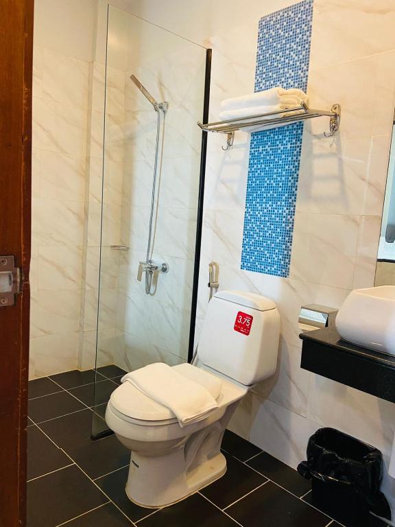 Koupelna v ubytování DE Hotel